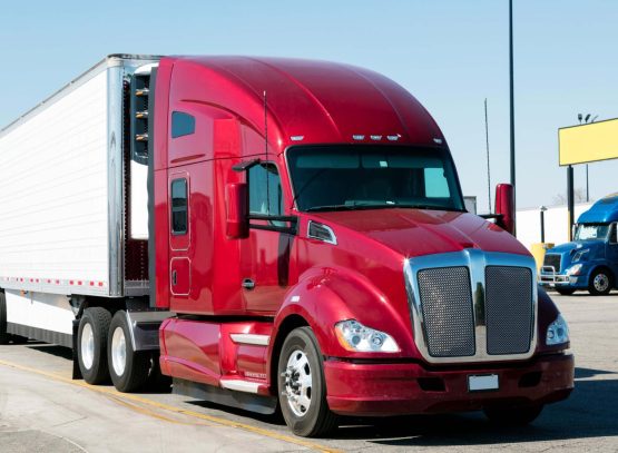 bright-red-semi-truck-trailer-parked-outdoors-2026-03-17-05-35-12-utc (1)