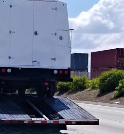 flatbed-hauling-truck-on-the-road-during-daytime-2026-03-19-23-06-52-utc (1)